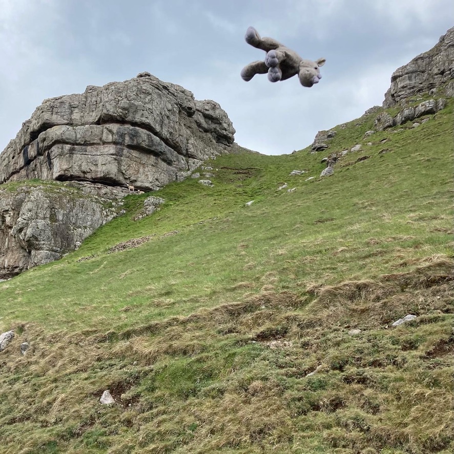 July on the calendar. Ronnie jumps for joy at The Great Orme. Some of the rock formation can be seen as he dives.
